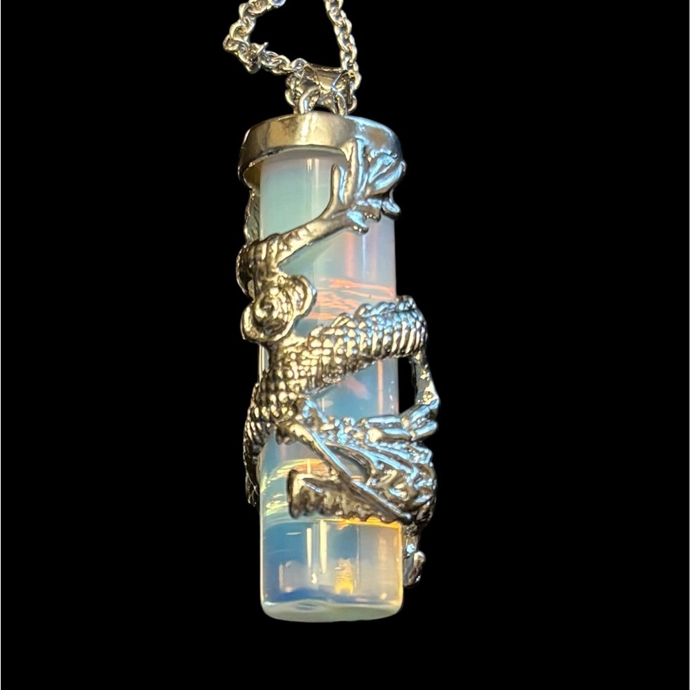Opalite cylindrical pendant encircled by silver dragon on 18” chain .